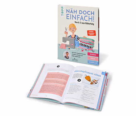 Das Buch "Näh doch einfach" liegt geöffnet neben einem stehenden Buch "Näh doch einfach".