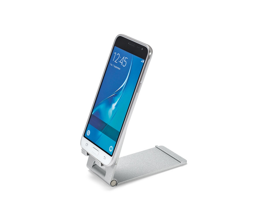 Ein silbernes Smartphone steht in einem Smartphone-und-Tablet-Ständer.