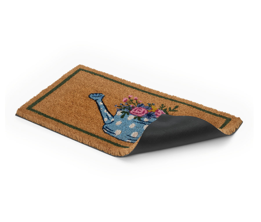 Fußmatte mit Gießkannenmotiv und Blumen.