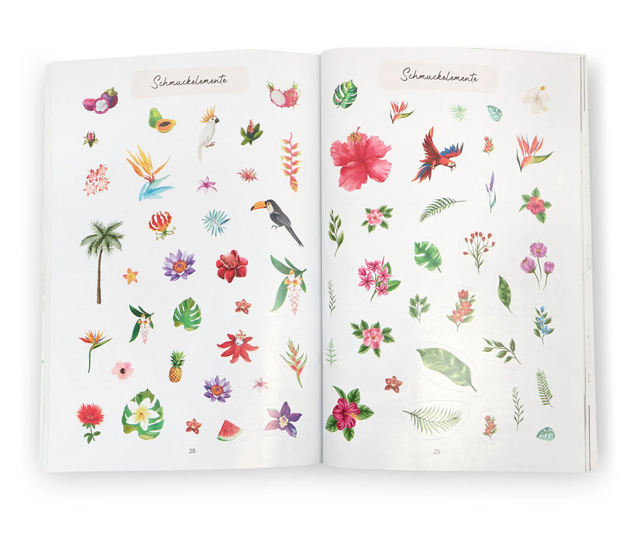 Offenes Buch „Stickerträume“ mit tropischen Aufklebern.