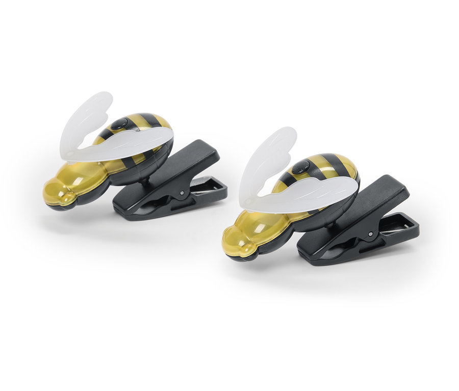 Zwei Bienen-Clip-Leuchten liegen auf einem weißen Hintergrund.
