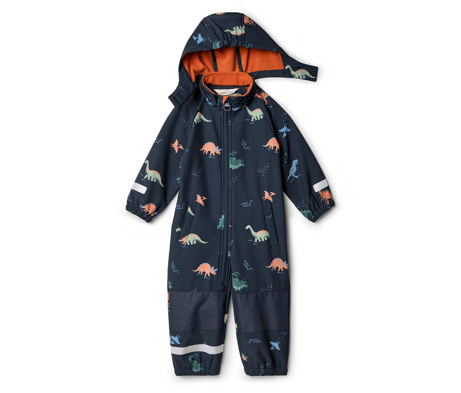 Marineblauer Overall mit Kapuze und Dinosaurier-Muster liegt auf dem Boden.
