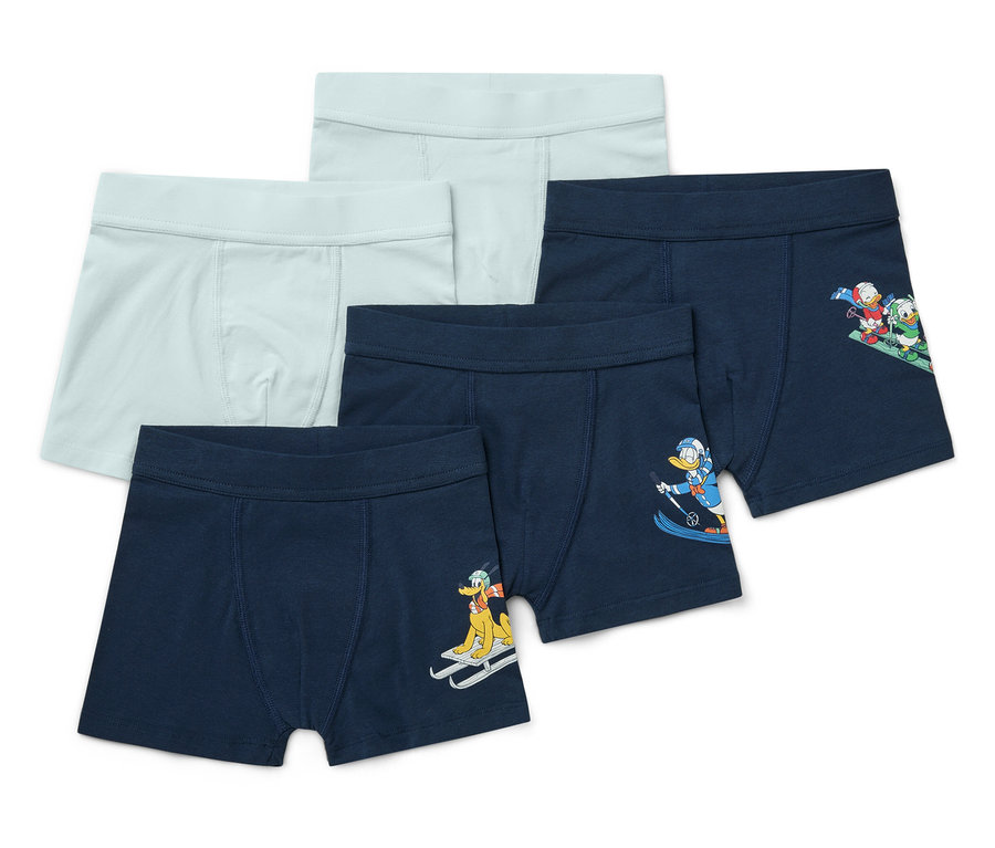 Fünf Kinderboxershorts: zwei hellblaue und drei dunkelblaue mit dem Aufdruck von Zeichentrickfiguren beim Skifahren.