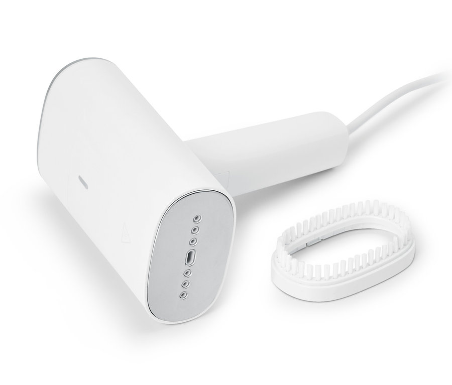 Weiße Dampfbürste mit Aufsatz.