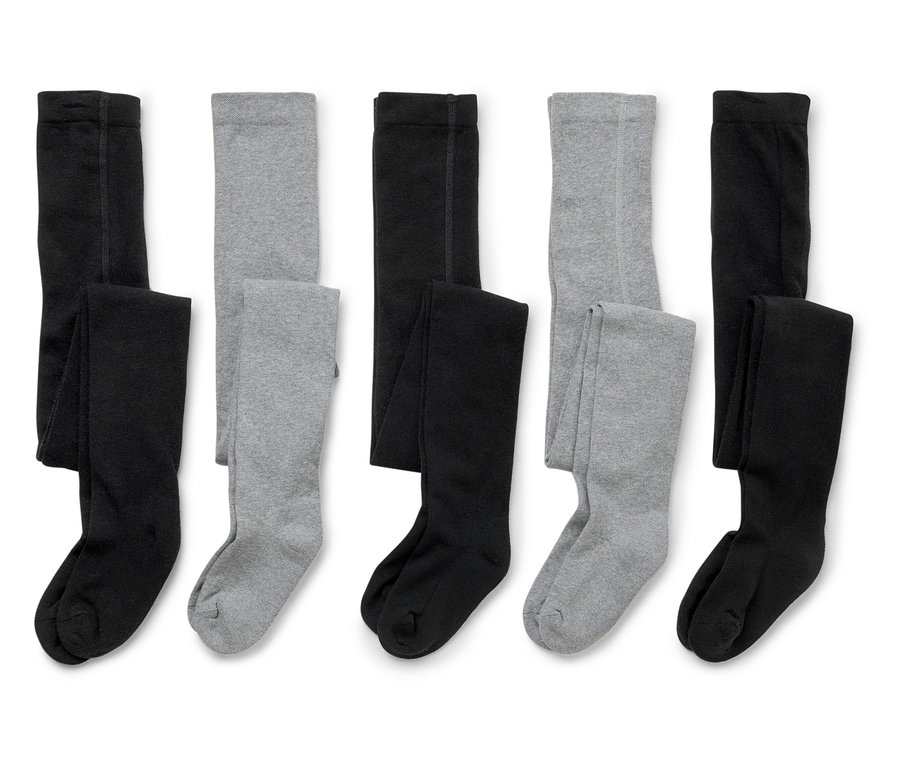 Fünf Paar Kinderstrumpfhosen liegen auf einem weißen Hintergrund, abwechselnd in Schwarz und Grau.