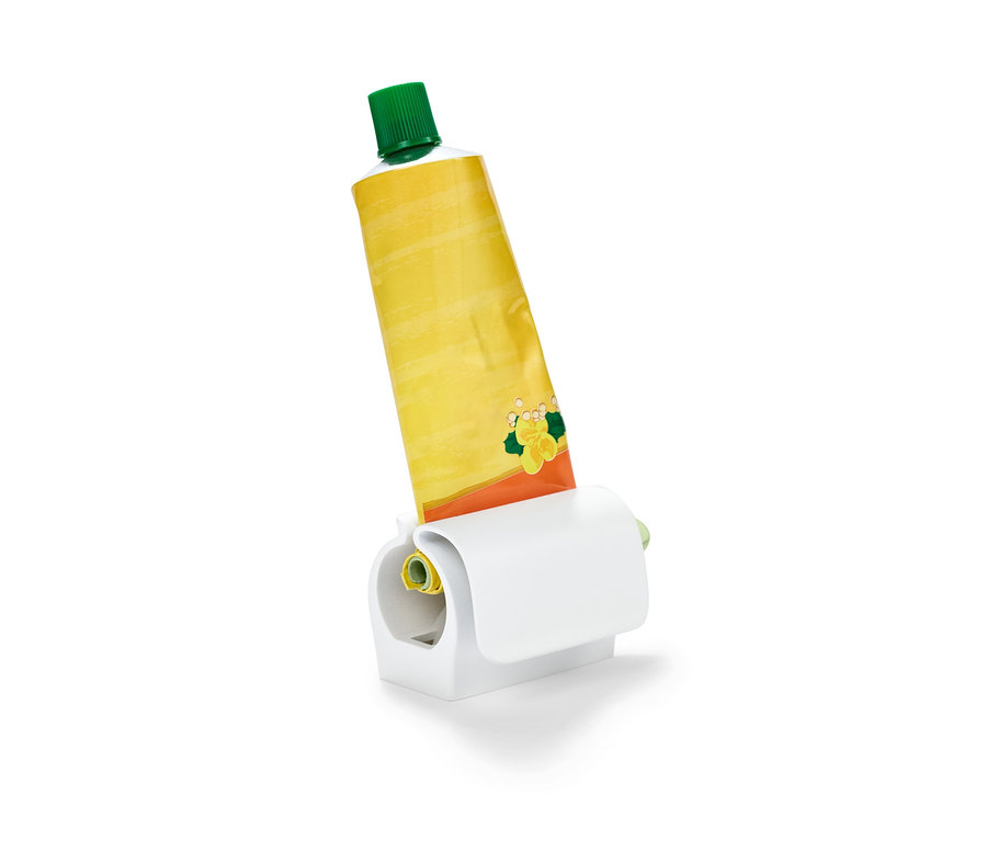 Gelbe Tube in Tubenpresser mit Kühlschrankclip.