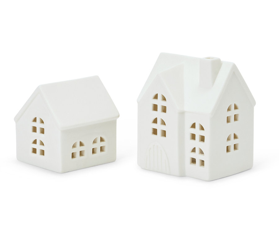 Zwei weiße Keramikhäuser mit Fenstern.