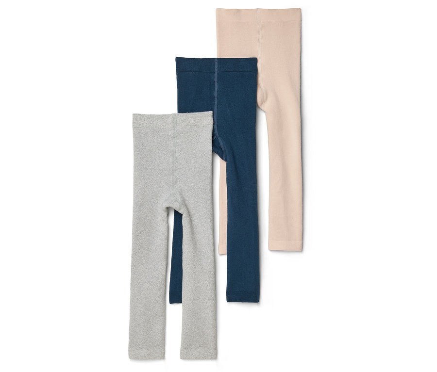 Drei Kinderleggings in Grau, Dunkelblau und Beige liegen übereinander auf einem weißen Hintergrund.