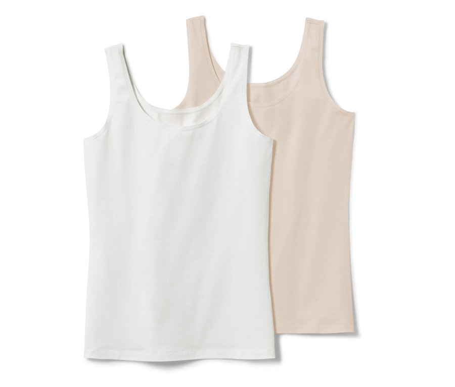 Zwei Hemdchen, 2 Stk., in Weiß und Creme liegen nebeneinander.