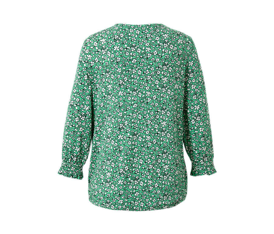 Grünes, bedrucktes Blusenshirt mit kleinen, weißen Blumen.