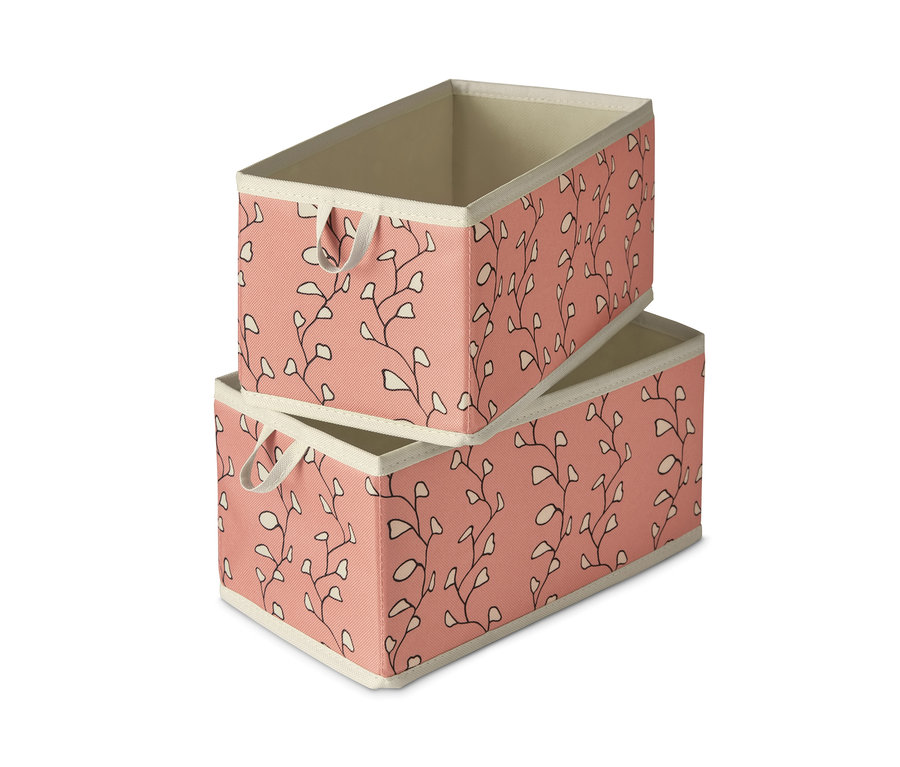 Zwei mittelgroße Schubladen-Ordnungsboxen sind übereinander gestapelt. Die Boxen sind rosa mit beigem Rand und Blattdruck.