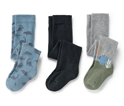 Drei Paar Baby-Strumpfhosen: blau mit Dinosauriern, schwarz und grau mit Dinosaurier-Motiv.