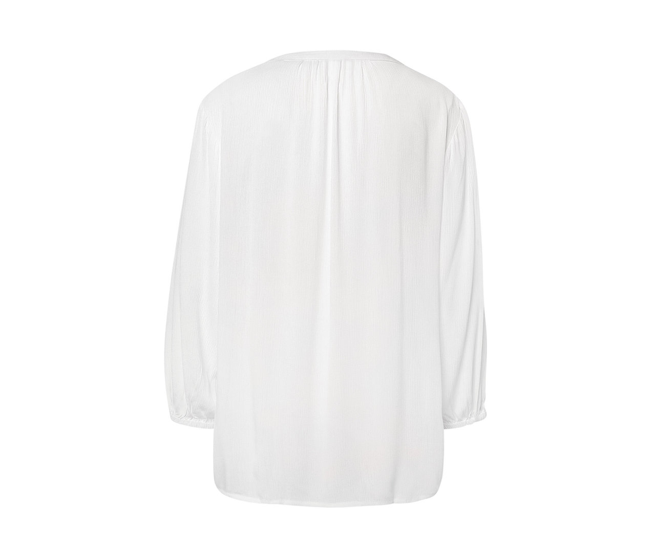 Detail einer weißen Tunika-Bluse.