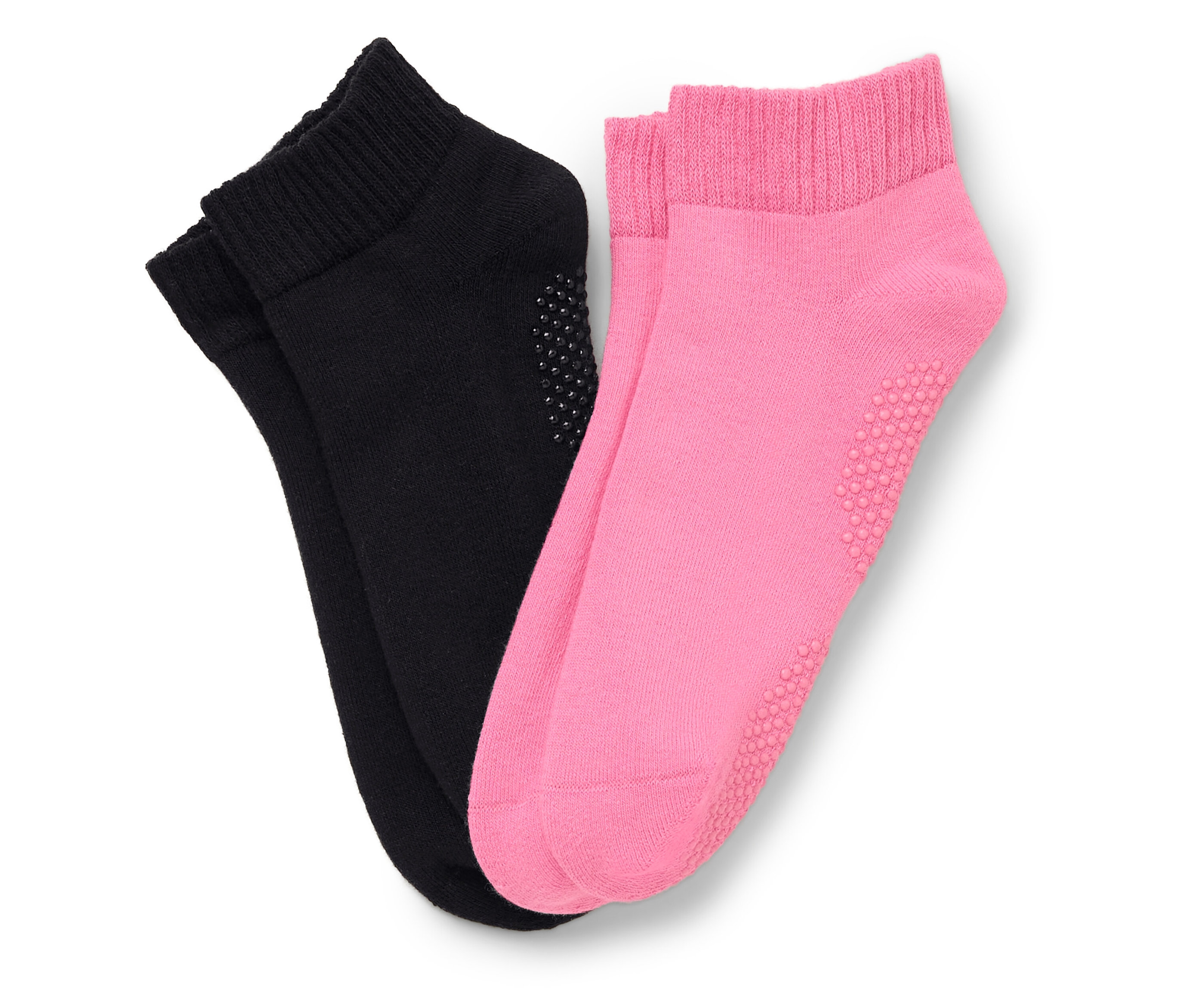 Ein Paar Socken, eine schwarz und eine pink, liegen nebeneinander.