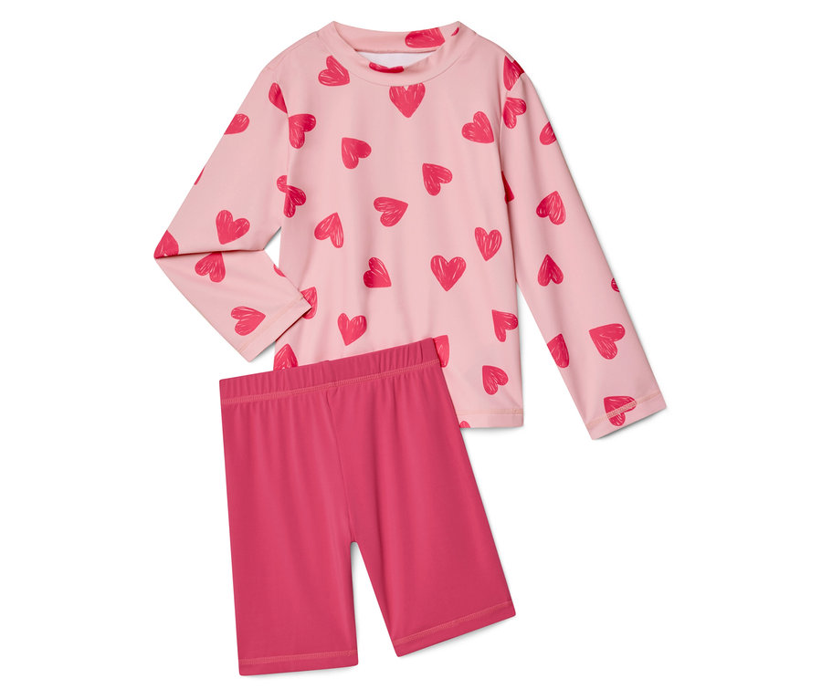 Rosa, langärmliges Oberteil mit Herzmuster und pinke, kurze Leggings.