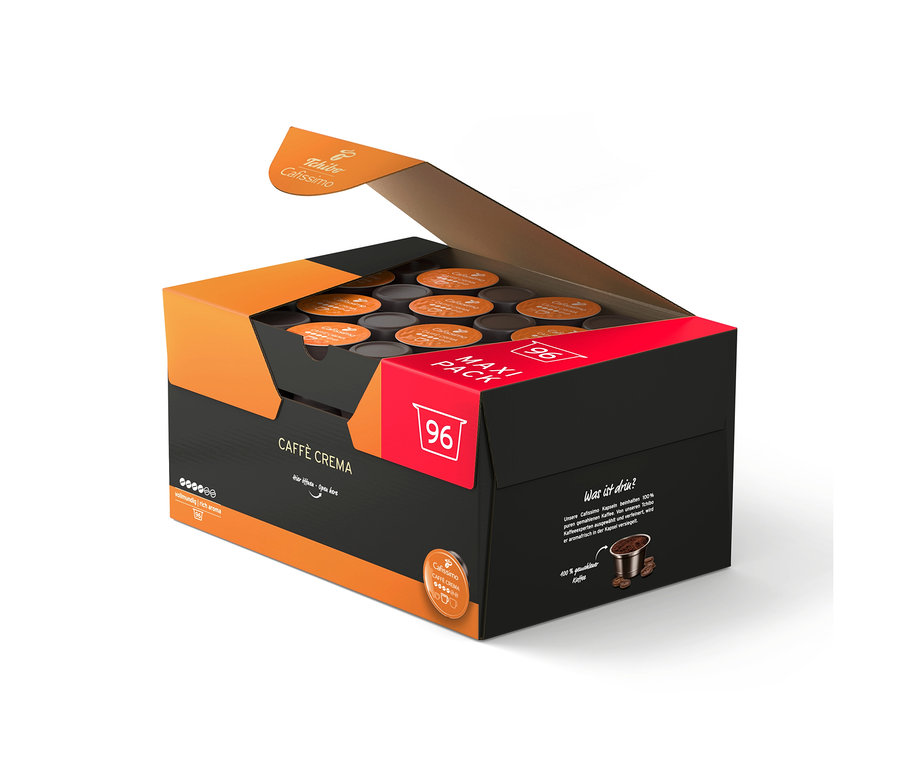 Offene schwarze und orangefarbene Box mit 96 Tchibo Cafissimo Caffè Crema vollmundig Kaffeekapseln.