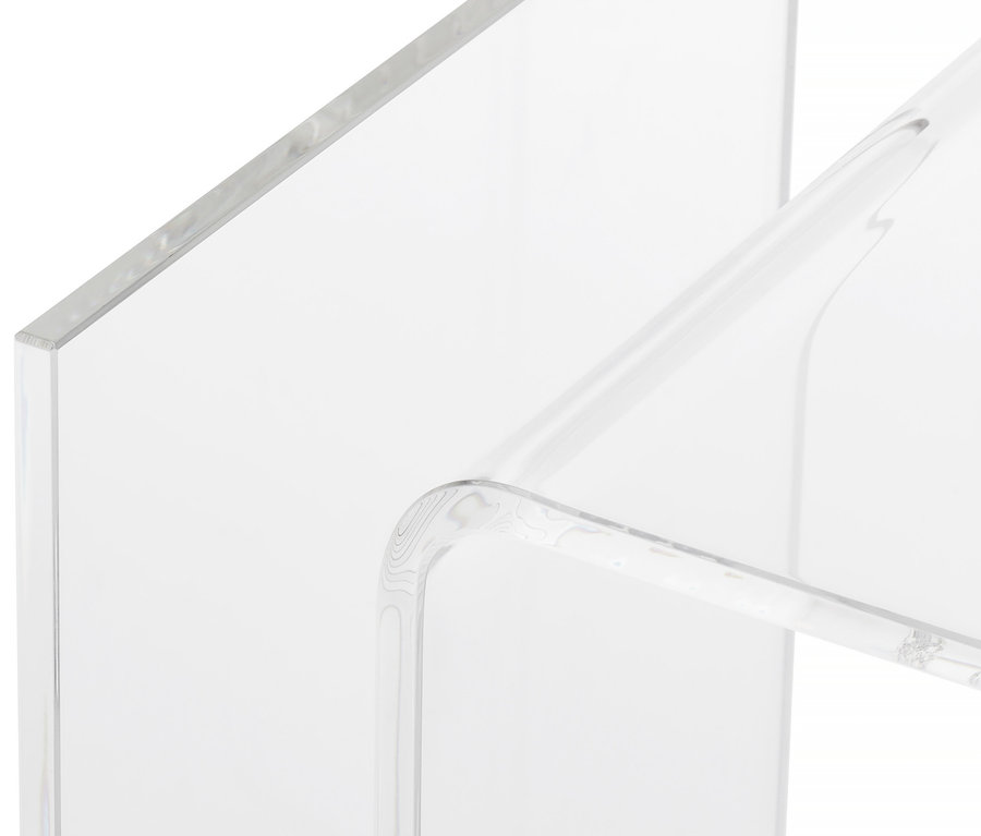 Detailansicht eines Beistelltisches aus Acrylglas mit Magazinhalter.