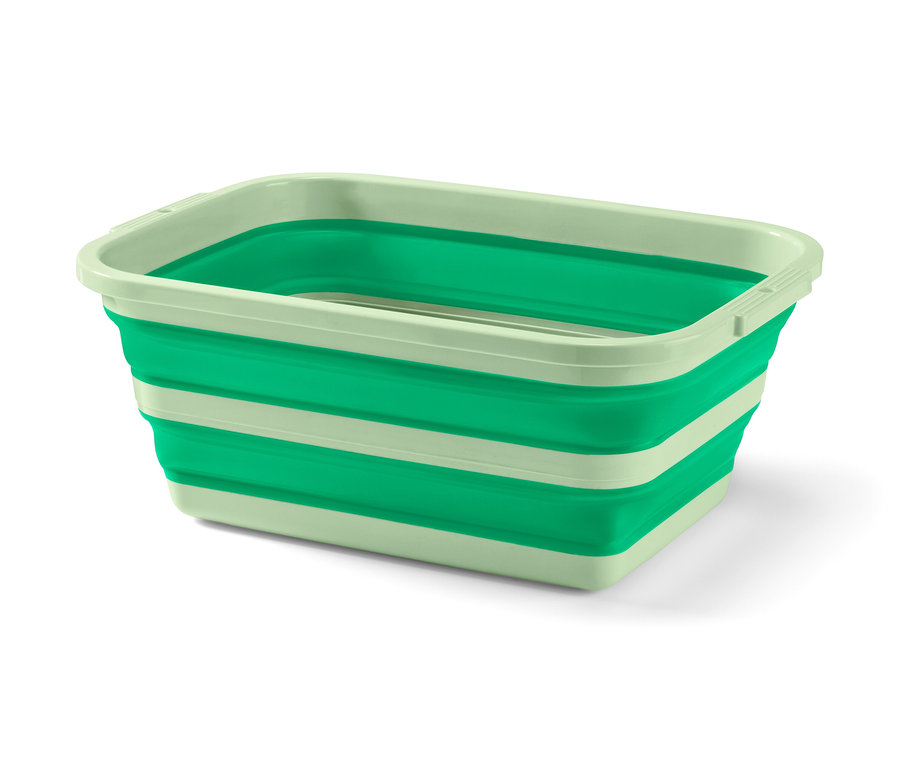 Ein grüner, faltbarer Wäsche- und Spülkorb.