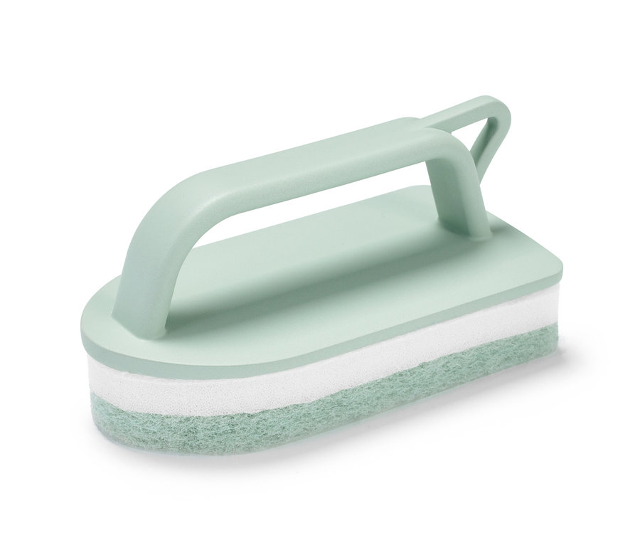 Ein hellgrüner Fliesenblitz mit weißem Schwamm in der Mitte.