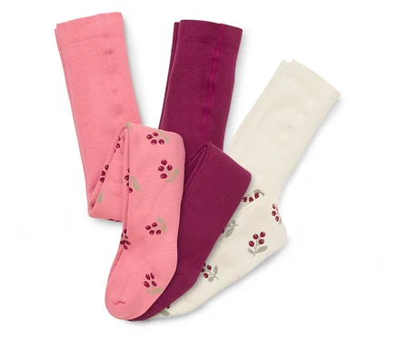 Drei Kinder-Frottee-Thermostrumpfhosen: eine rosa, eine dunkelrosa und eine cremefarbene mit Beerenmuster.