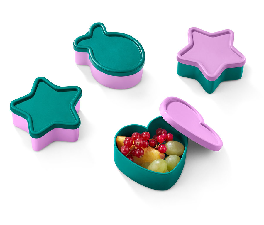 Vier farbige Brotdosen in Form von Stern, Fisch und Herz.