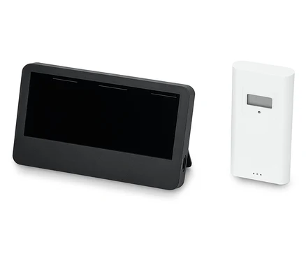 Ein schwarzes Tablet neben einem weißen Sensor.