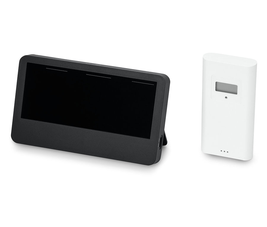 Ein schwarzes Tablet neben einem weißen Sensor.