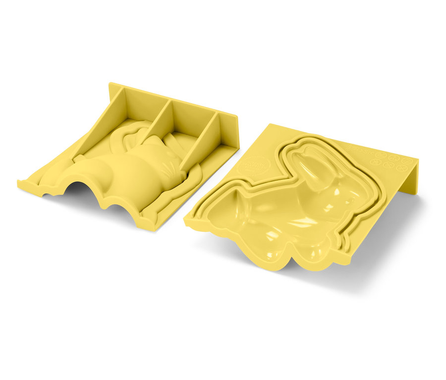 Zwei gelbe Hasenformen liegen auf einem weißen Hintergrund.