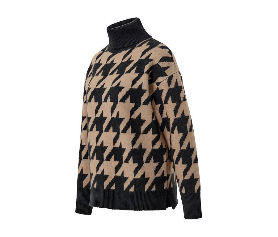Detailaufnahme eines Strickpullovers mit Hahnentritt-Jacquardmuster.