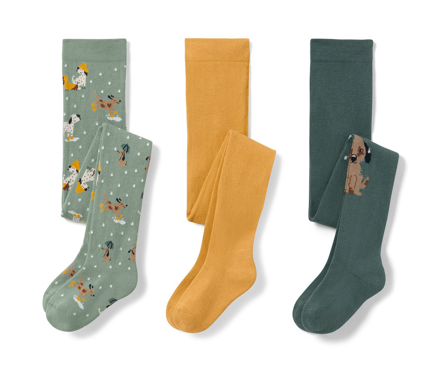 Drei Kinder-Strumpfhosen: hellgrün mit Hundemuster, gelb und dunkelgrün mit Hund.