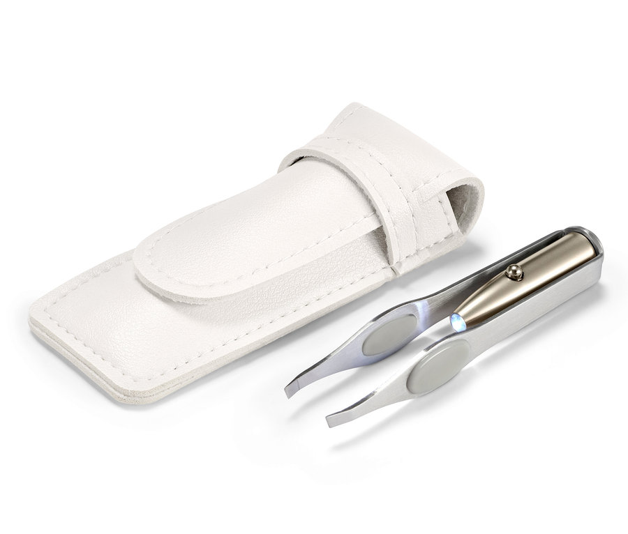 Pinzette mit LED-Licht neben einem weißen Etui.
