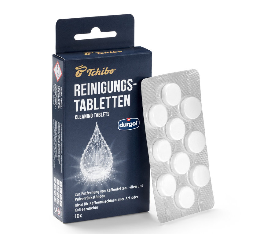 Eine Packung durgol® Reinigungstabletten für Kaffeeöle und eine Blisterpackung mit Tabletten.