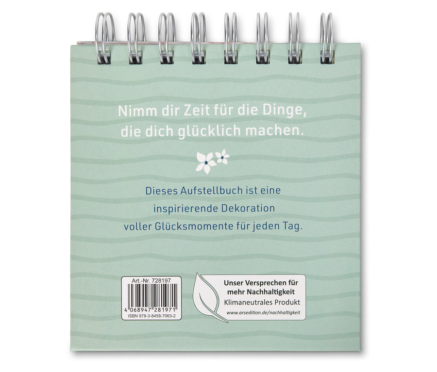 Aufstellbuch mit der Aufschrift "Nimm dir Zeit für die Dinge, die dich glücklich machen."