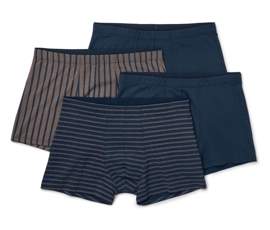 Vier Herren Boxershorts: zwei blaue, eine blau-grau gestreifte und eine braun-grau gestreifte.