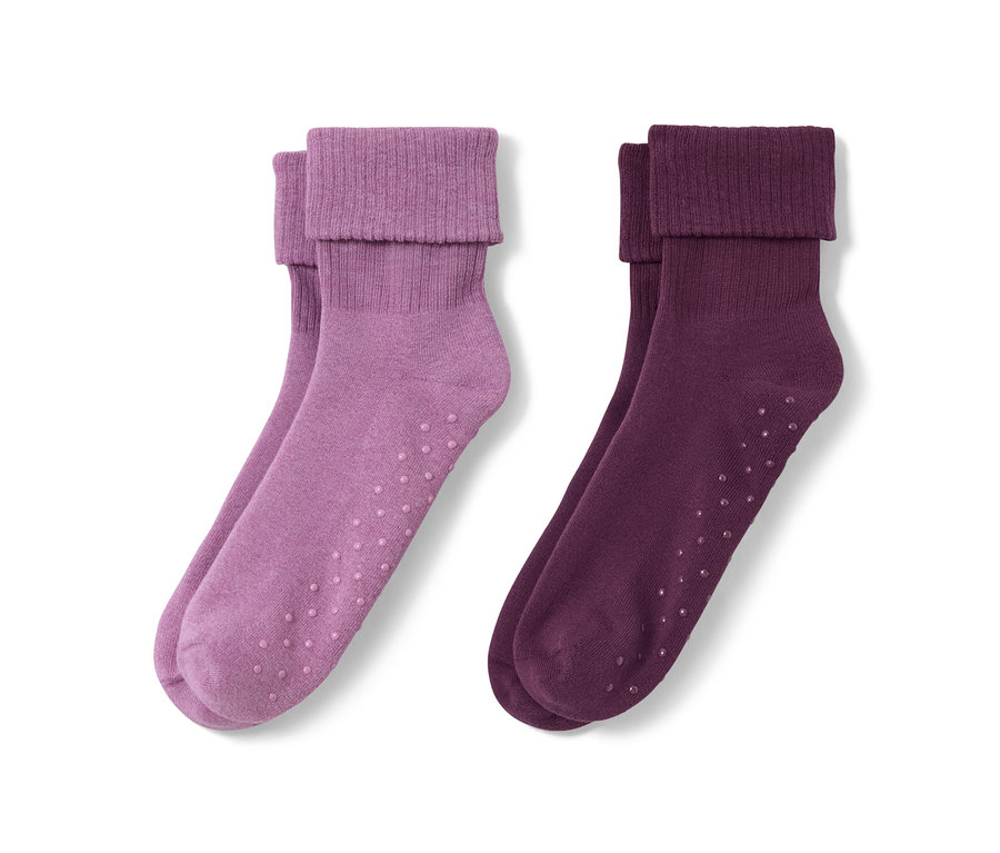 Zwei Paar Stoppersocken: lila und purpurfarben.