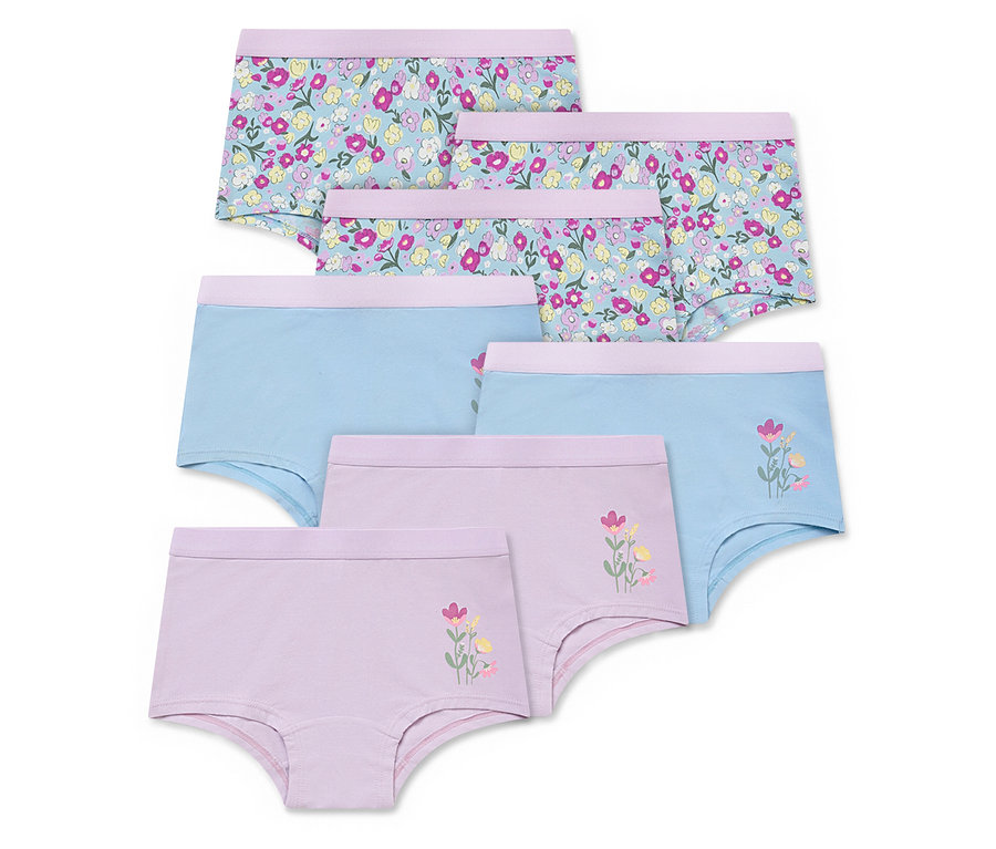 Gestapelte 7 Kinder-Pantys in verschiedenen Designs: Blumenmuster, einfarbig blau und lila mit Blumenapplikation.