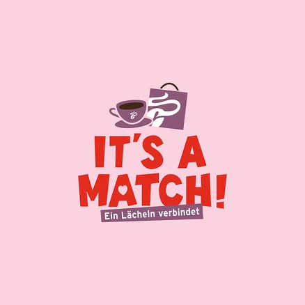 Auf rosa Hintergrund: Kaffeetasse, Einkaufstüte und der Slogan "It's a Match! Ein Lächeln verbindet".