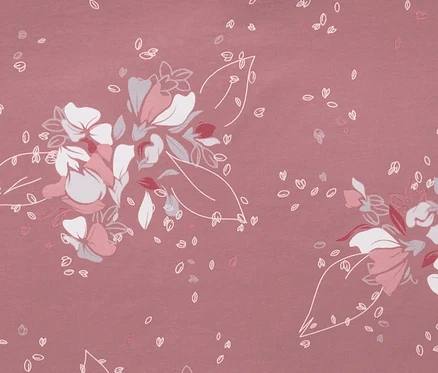 Detailaufnahme von rosafarbener Jersey-Bettwäsche in Normalgröße mit Blumenmuster.