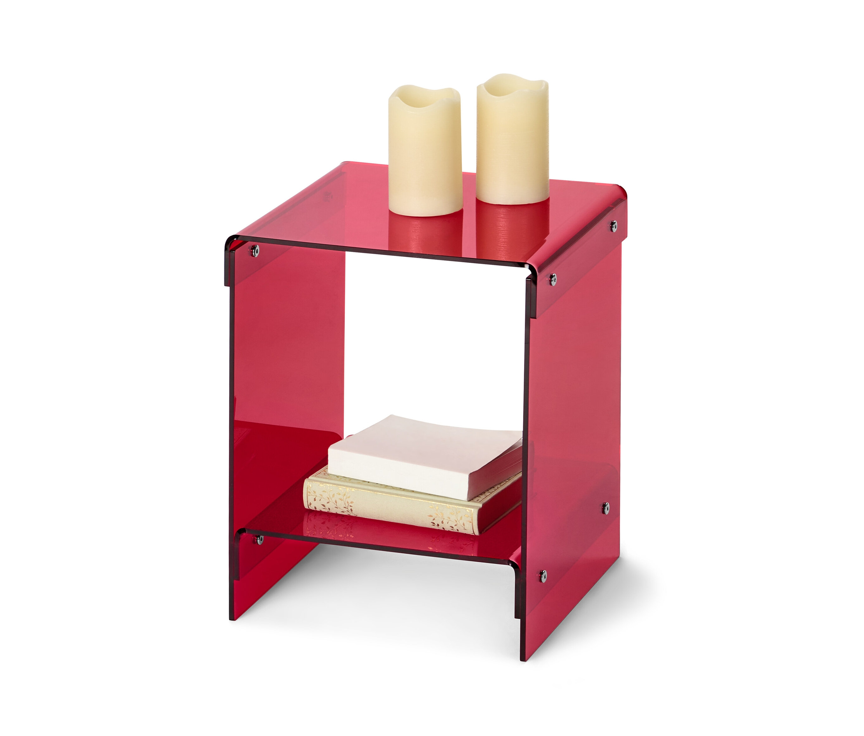 Roter Beistelltisch aus Acrylglas mit zwei Kerzen oben und Büchern im unteren Regal.