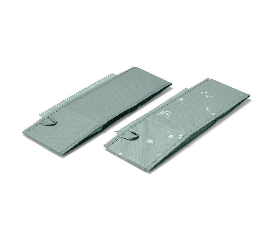 Zwei mittelgroße Schubladen-Ordnungsboxen in Graugrün, eine davon mit Blumenmuster.