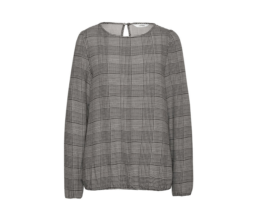 Detail einer Damenbluse mit langen Ärmeln und Muster.