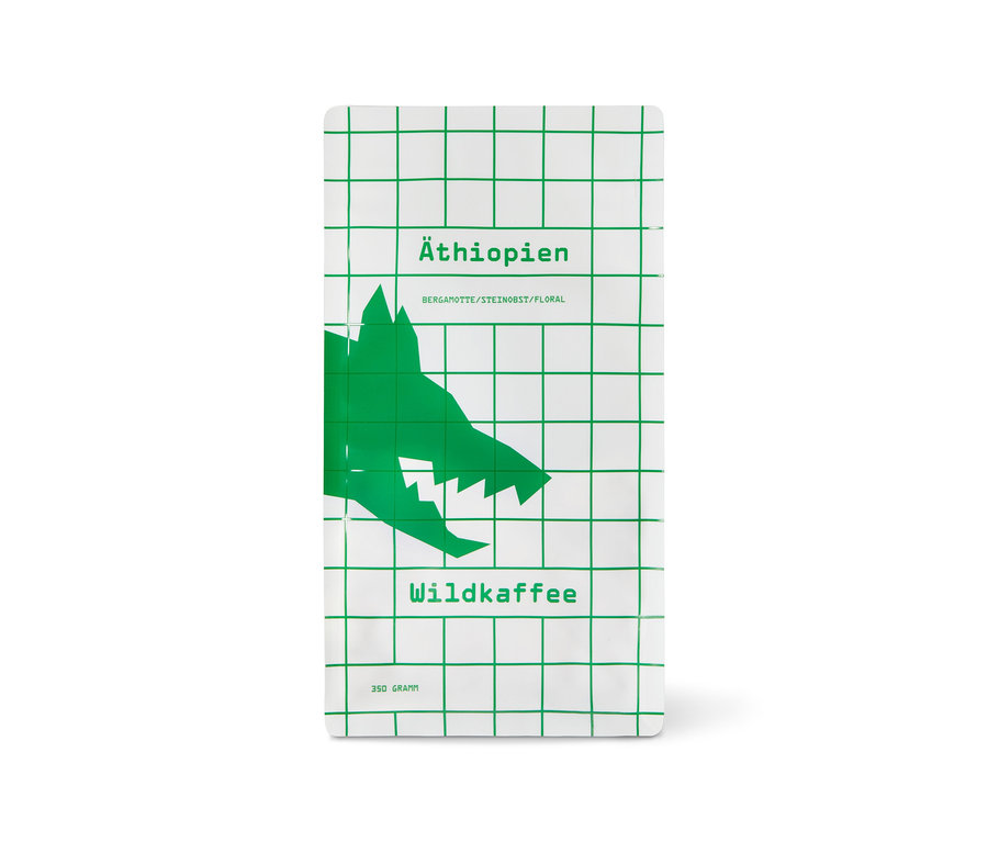 Weiße Packung Wildkaffee Äthiopien West Arsi Omni-Roast mit grünem Gittermuster und Wolfskopf, 350 g Ganze Bohne.