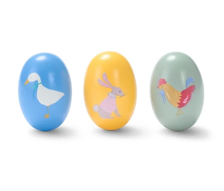 Drei Rassel-Eier mit Tiermotiven.