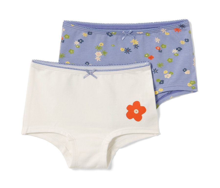 Zwei Kleinkind-Pantys, eine weiß mit orangefarbener Blume, die andere blau mit Blumenmuster.