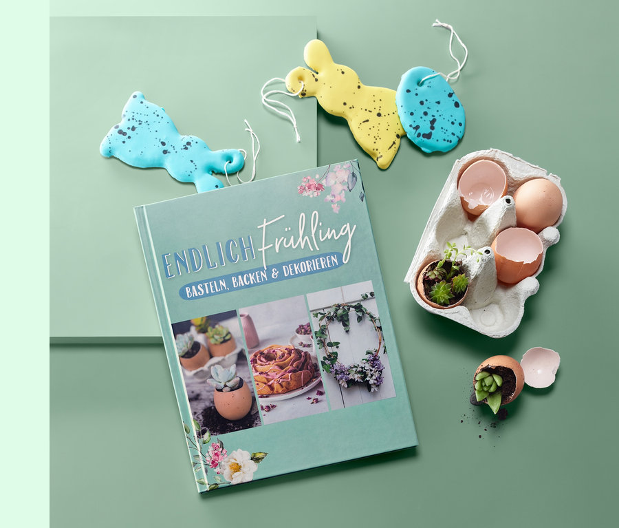 Buch »Endlich Frühling – Basteln, Backen und Dekorieren«, daneben Deko in Hasen- und Eiform sowie Eierschalen mit Sukkulenten.