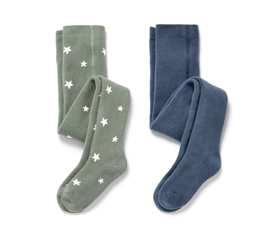 Zwei Kinder-Thermostrumpfhosen, blau und grün. Eine grün mit weißen Sternen.