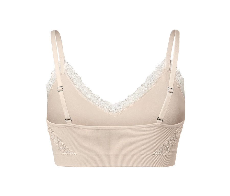 Detailansicht eines creme Seamless-Bustiers mit Spitze.