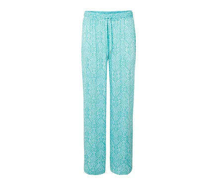 Türkise Relaxhose mit weißem Muster.