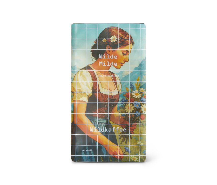 Nahaufnahme der Wildkaffee Wilde Milde Omni-Roast 350 g Ganze Bohne Packung mit Frau und Blumenmotiv.