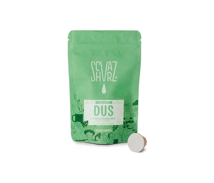 Grüne Packung Schvarz - DUS Lungo - 10 Kapseln mit einer Kaffeekapsel daneben.